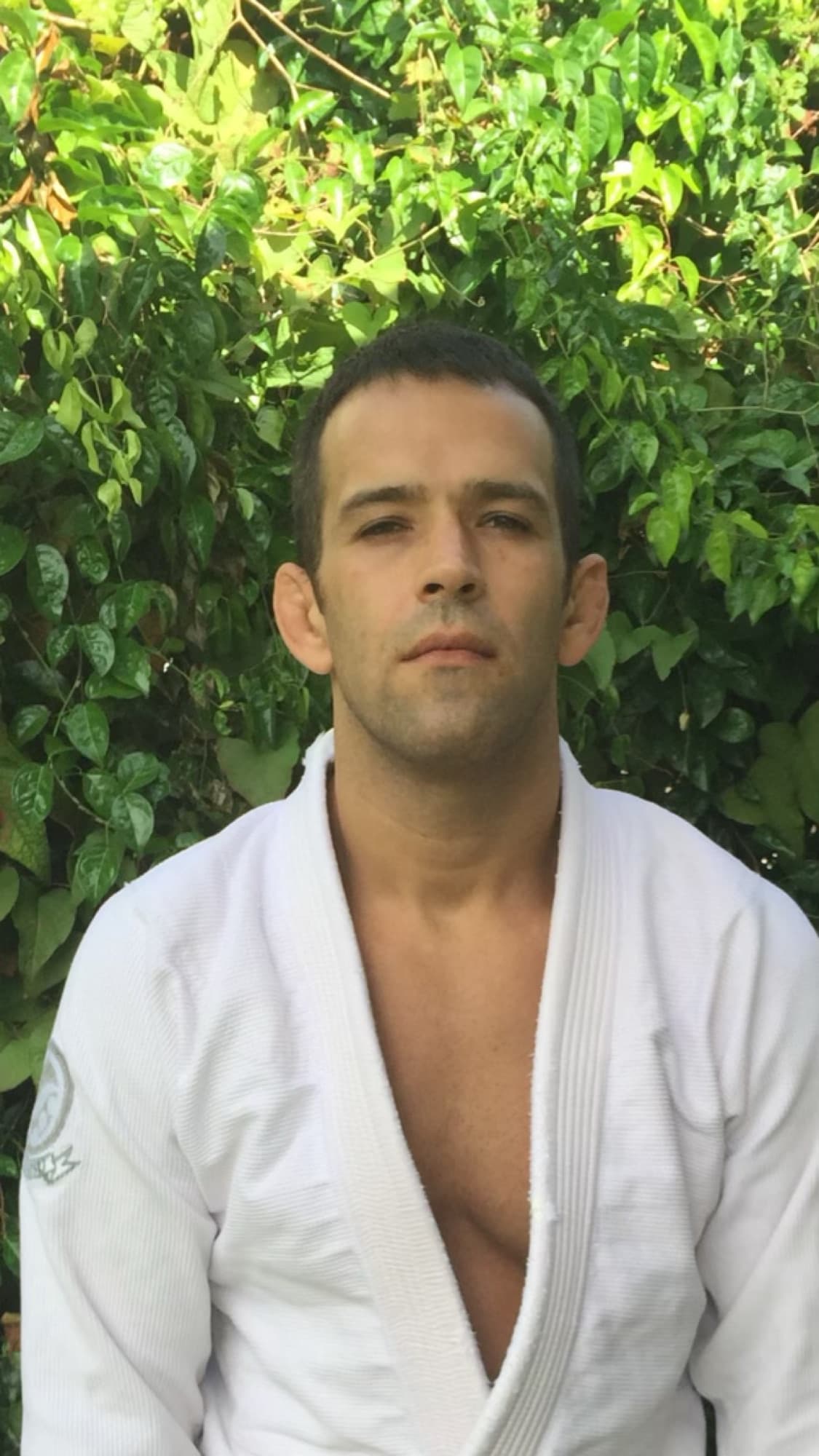 Portrait of Joel Bouhey in a white gi.